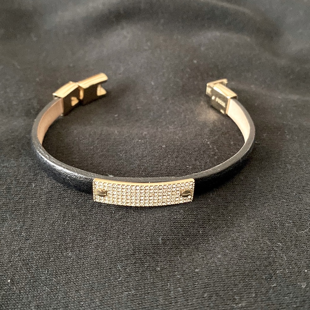 Black leather and gold bracelet